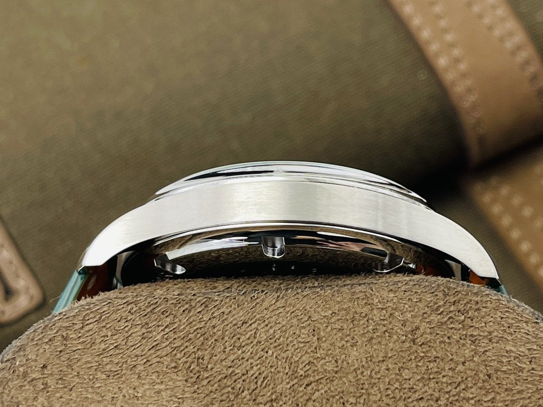PORTUGUESE HAND-WOUND STEEL CASE GREEN DIAL