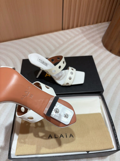ALAIA TWO-STRAPS HIGH HEEL SANDALS IN WHITE PATENT LAMBSKIN