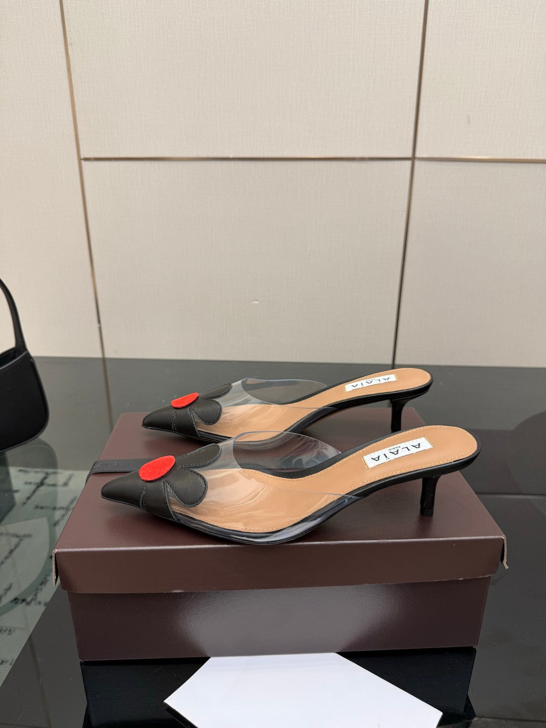 Alaia 2026 Mules 55 PVC Sheepskin 803333