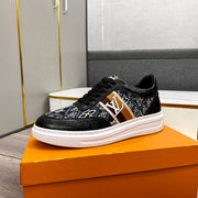 LV TRAINER IN BLACK EMBOSSED CALFSKIN AND MONOGRAM FABRIC