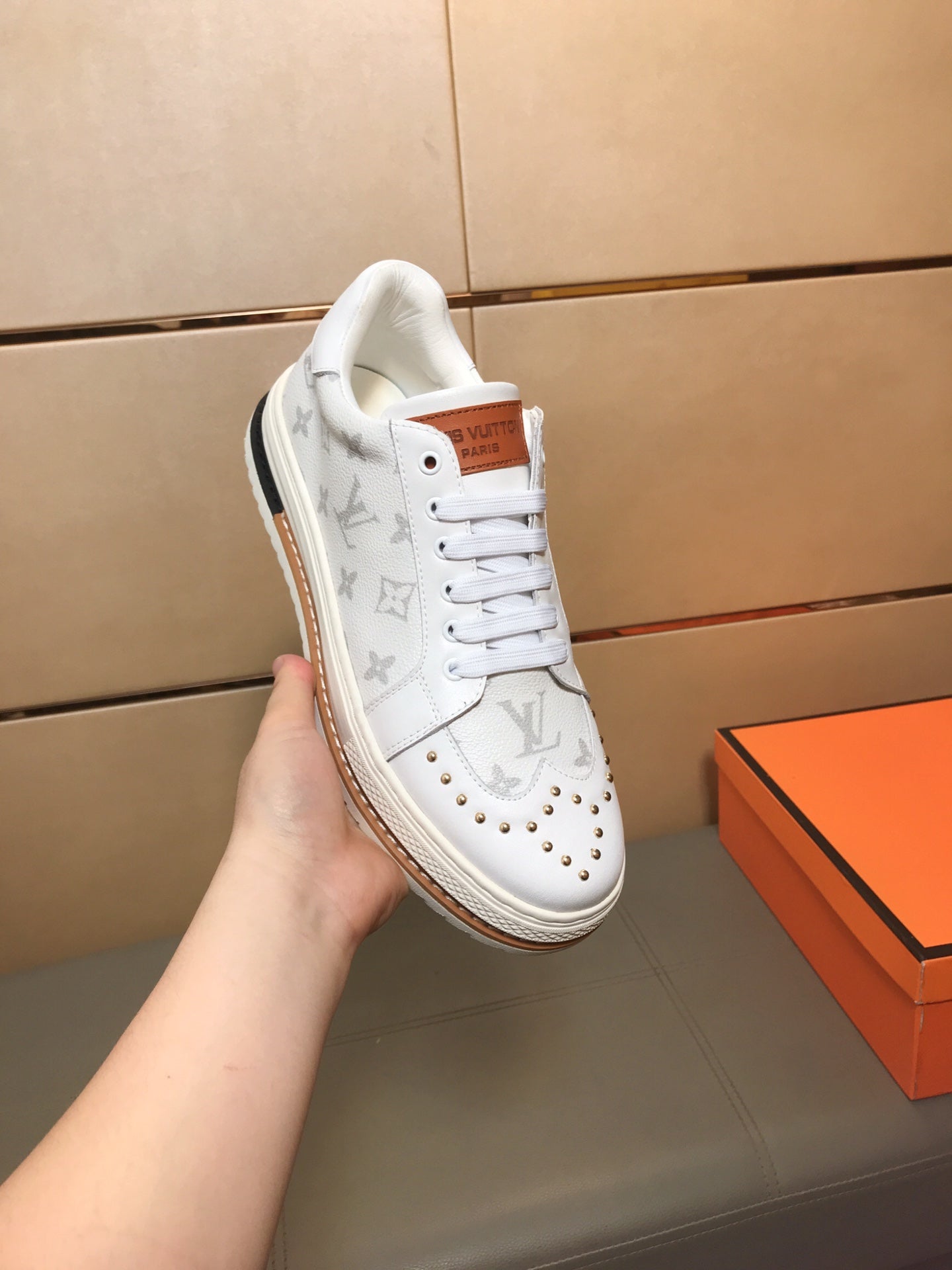 LV TRAINER IN WHITE MONOGRAM CALFSKIN