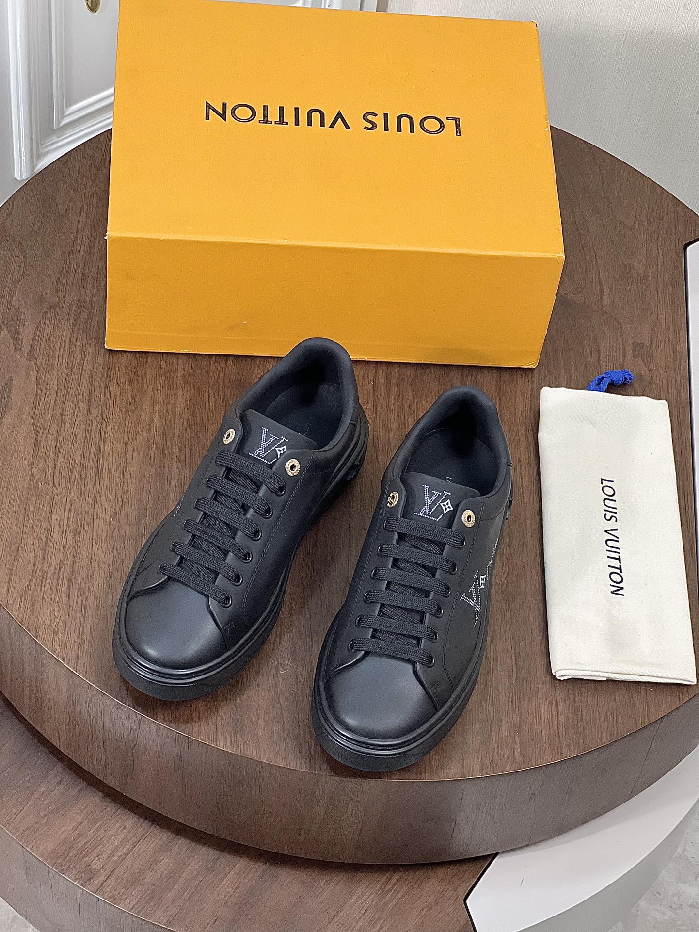 LV TIME OUT SNEAKER IN BLACK CALFSKIN