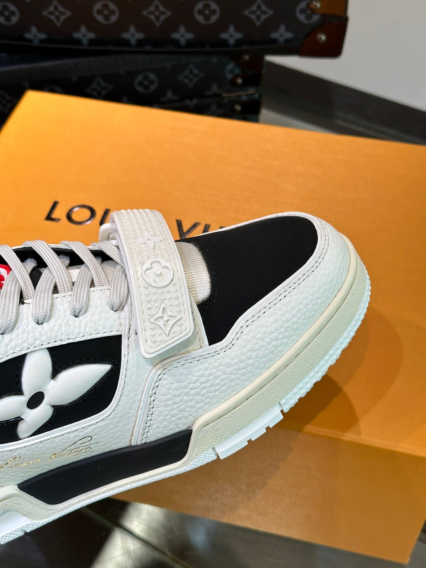 LV TRAINER SNEAKERS IN WHITE CALFSKIN AND BLACK SUEDE